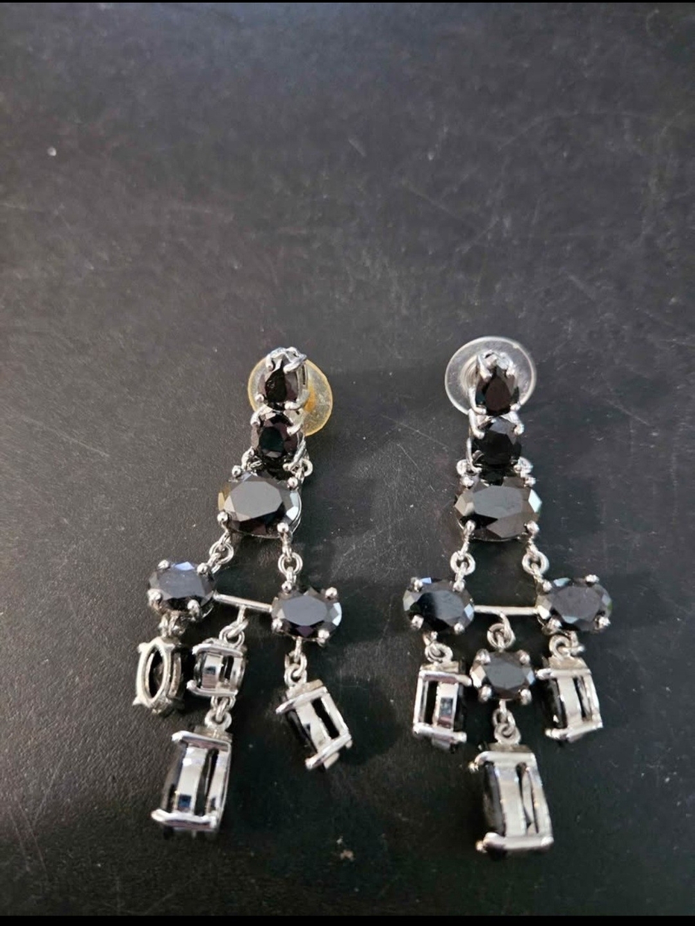 Chandelier earrings featuring black rhinestones